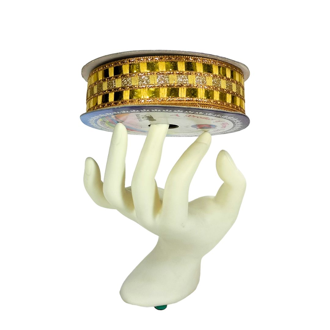 Decorative object with a hand-shaped base and gold circular top on a white background